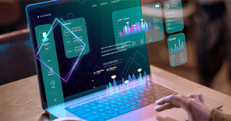 Tela de um notebook com vários dados, números, gráficos e itens saindo da tela